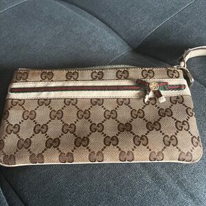 Gucci Beige and Brown Monogram Wristlet wallet with dust bag